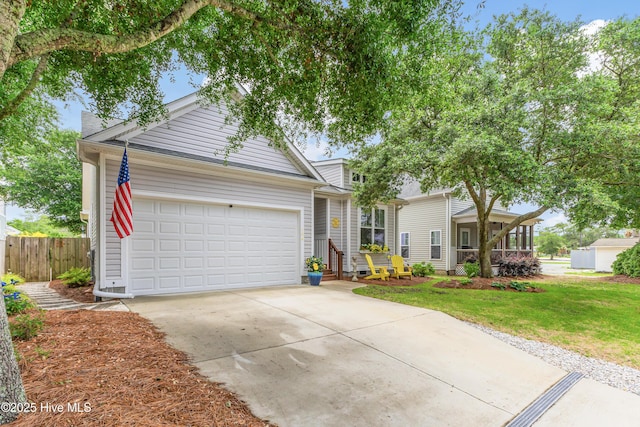 104 NE 63rd St, Oak Island, NC 28465 - view of front of property featuring driveway and a garage