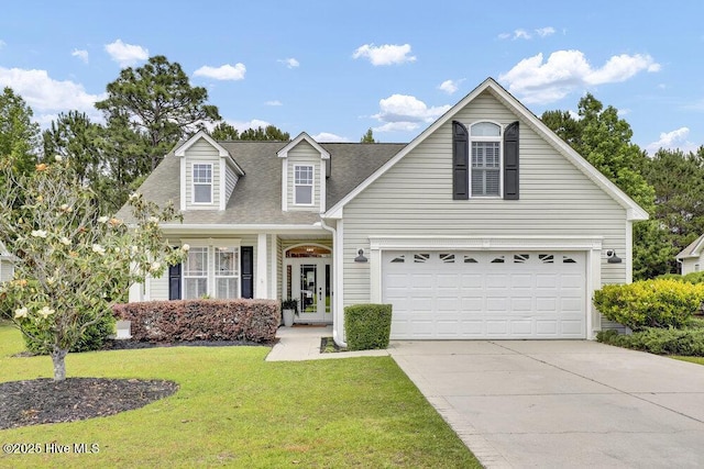 127 Azalea Dr, Hampstead, NC 28443 - view of front facade with concrete driveway, a front yard, a garage, and roof with shingles