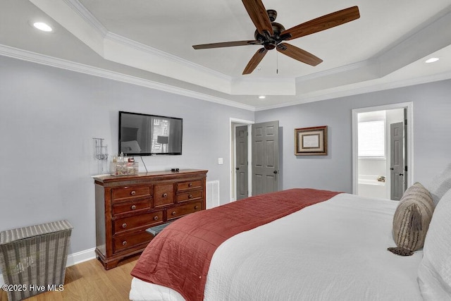 127 Azalea Dr, Hampstead, NC 28443 - bedroom featuring a tray ceiling, ornamental molding, light wood finished floors, recessed lighting, and a ceiling fan