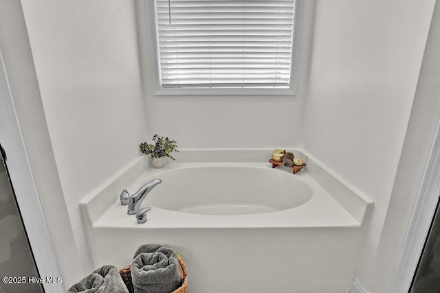127 Azalea Dr, Hampstead, NC 28443 - bathroom with a garden tub and plenty of natural light
