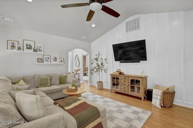 127 Azalea Dr, Hampstead, NC 28443 - living room with arched walkways, lofted ceiling, a ceiling fan, light wood-style flooring, and recessed lighting