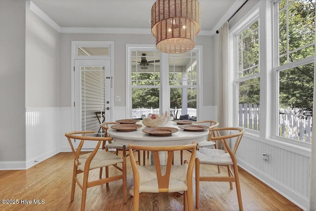 127 Azalea Dr, Hampstead, NC 28443 - dining room with light wood-style flooring, a wainscoted wall, ornamental molding, and ceiling fan