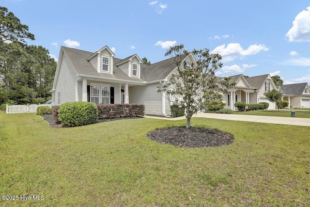 127 Azalea Dr, Hampstead, NC 28443 - cape cod house with driveway and an attached garage