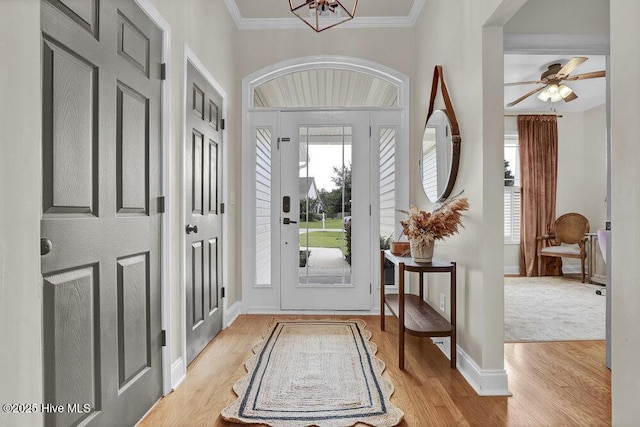 127 Azalea Dr, Hampstead, NC 28443 - entrance foyer with wood finished floors, ornamental molding, baseboards, and ceiling fan