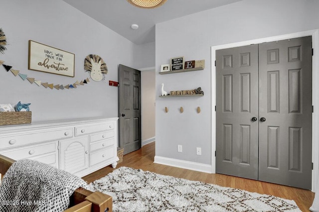 127 Azalea Dr, Hampstead, NC 28443 - bedroom with light wood-style flooring, baseboards, and a closet