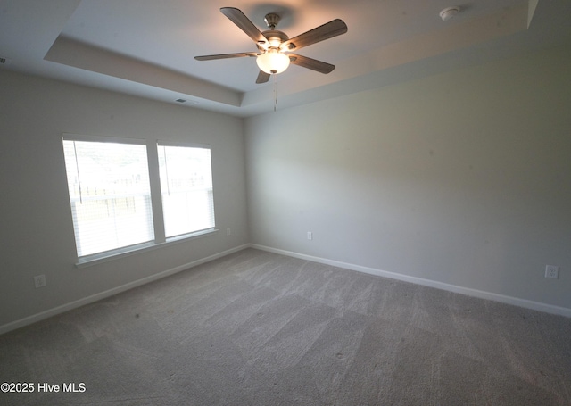 9308 Little Osprey Dr, Calabash, NC 28467 - empty room with a raised ceiling, carpet floors, a ceiling fan, and a smoke detector