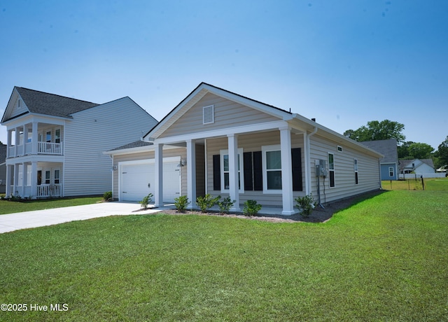 9308 Little Osprey Dr, Calabash, NC 28467 - view of front of property featuring a garage, a front lawn, concrete driveway, and covered porch