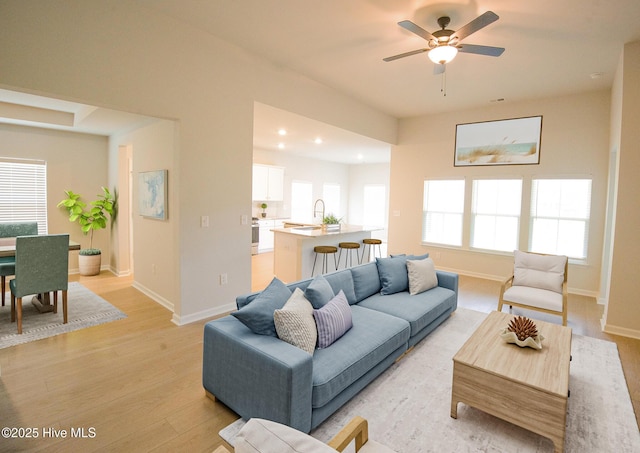 9308 Little Osprey Dr, Calabash, NC 28467 - living room with light wood-style flooring, a ceiling fan, and recessed lighting