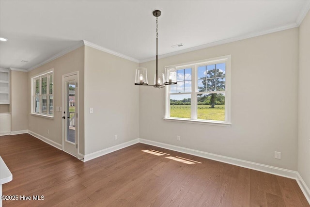 2190 Heartland Rd, Battleboro, NC 27809 - unfurnished dining area featuring a chandelier, baseboards, wood finished floors, and ornamental molding