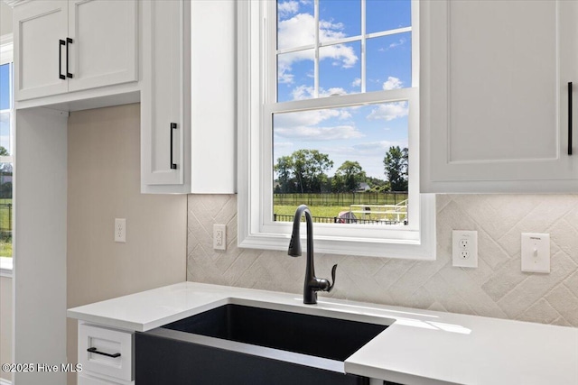 2190 Heartland Rd, Battleboro, NC 27809 - kitchen with light countertops and white cabinetry