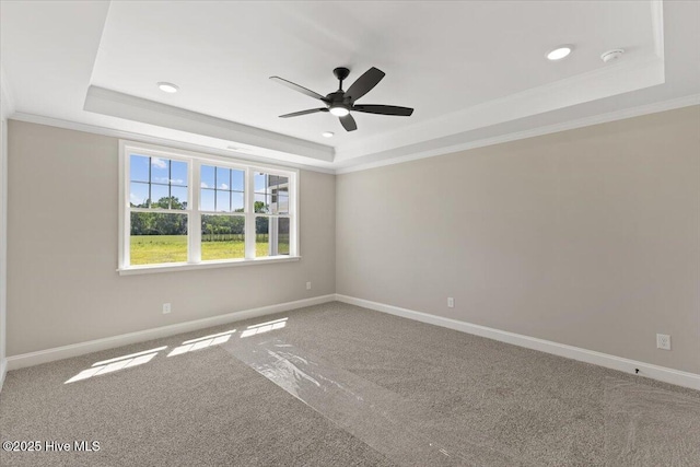2190 Heartland Rd, Battleboro, NC 27809 - carpeted empty room with a raised ceiling, a ceiling fan, ornamental molding, baseboards, and a smoke detector