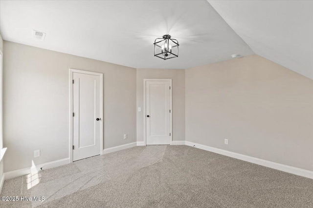 2190 Heartland Rd, Battleboro, NC 27809 - bonus room with carpet flooring, a chandelier, baseboards, and vaulted ceiling