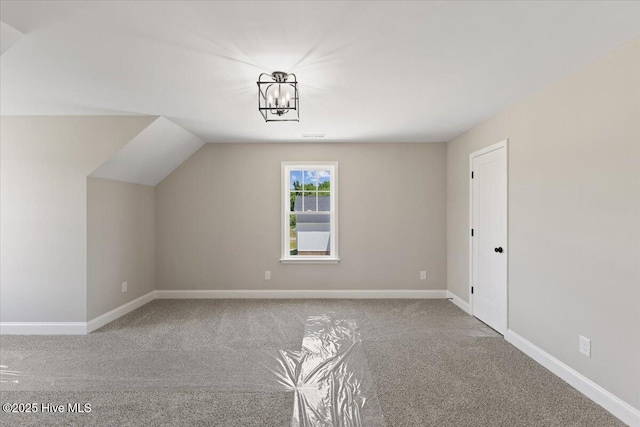 2190 Heartland Rd, Battleboro, NC 27809 - bonus room featuring carpet flooring, baseboards, and a chandelier