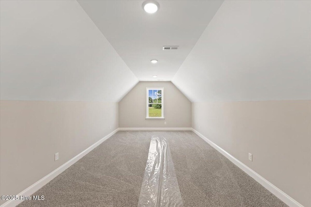 2190 Heartland Rd, Battleboro, NC 27809 - additional living space featuring vaulted ceiling, baseboards, and carpet