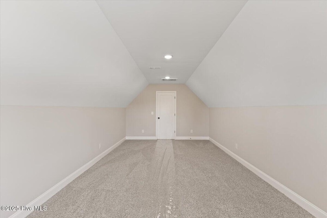 2190 Heartland Rd, Battleboro, NC 27809 - bonus room featuring baseboards, carpet floors, lofted ceiling, and recessed lighting