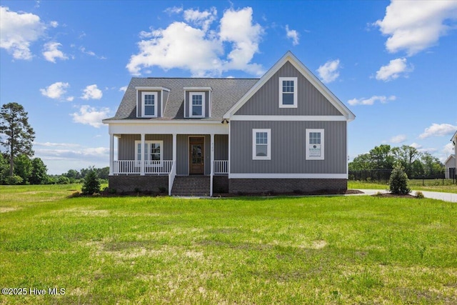 2190 Heartland Rd, Battleboro, NC 27809 - view of front of home with a porch, a front lawn, and a shingled roof
