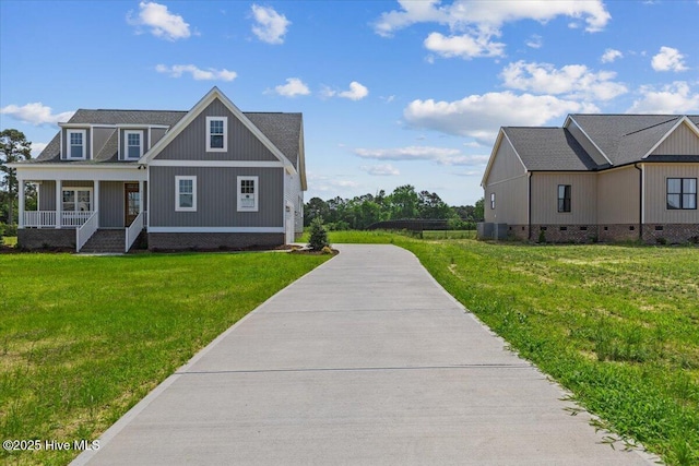 2190 Heartland Rd, Battleboro, NC 27809 - view of front of property with covered porch, a front yard, crawl space, and cooling unit