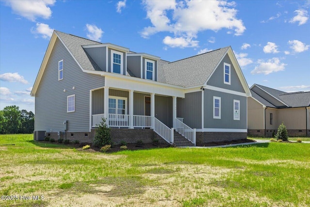 2190 Heartland Rd, Battleboro, NC 27809 - view of front facade featuring crawl space, covered porch, central AC unit, and a front lawn