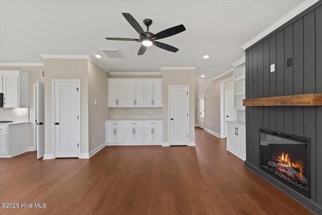 2190 Heartland Rd, Battleboro, NC 27809 - unfurnished living room featuring a ceiling fan, baseboards, crown molding, recessed lighting, and dark wood-type flooring