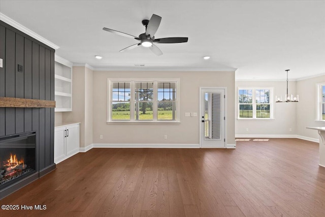 2190 Heartland Rd, Battleboro, NC 27809 - unfurnished living room featuring crown molding, a large fireplace, a chandelier, baseboards, and dark wood-type flooring