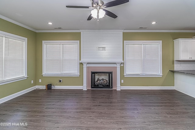 1707 N Carolina St, Goldsboro, NC 27530 - unfurnished living room with ornamental molding, a fireplace, a ceiling fan, dark wood finished floors, and recessed lighting