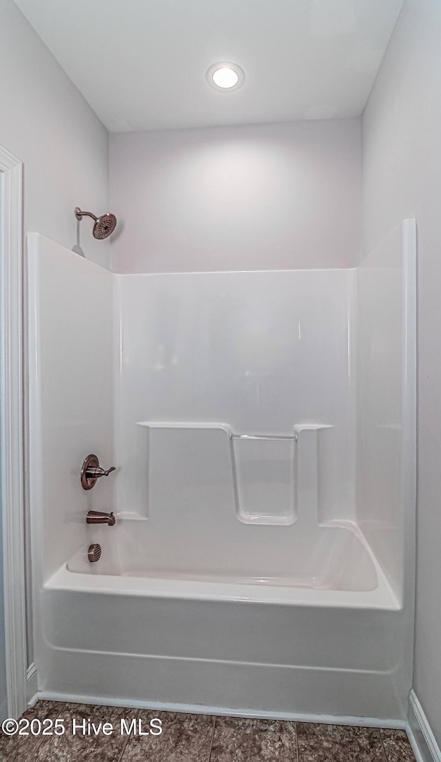1707 N Carolina St, Goldsboro, NC 27530 - bathroom featuring bathing tub / shower combination, baseboards, and tile patterned floors