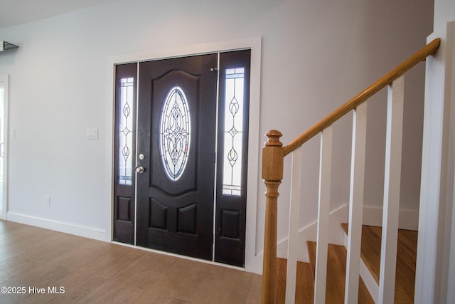 302 N 16th St, Morehead City, NC 28557 - entryway featuring wood finished floors, stairway, and baseboards