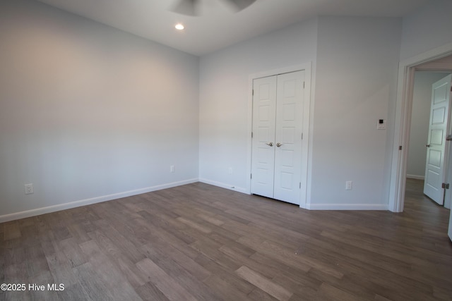 302 N 16th St, Morehead City, NC 28557 - unfurnished bedroom featuring baseboards, dark wood finished floors, recessed lighting, and a closet
