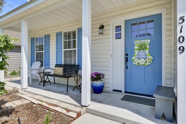 5109 Gate Post Ln, Wilmington, NC 28412 - view of exterior entry with a porch