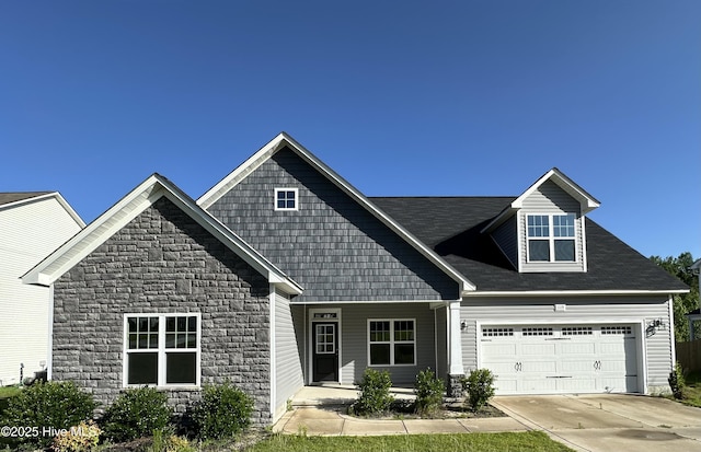 1115 Camellia Dr, Vass, NC 28394 - view of front of property featuring stone siding, concrete driveway, a garage, and covered porch