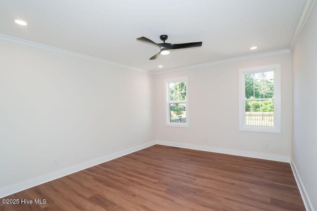 472 Yadkin Rd, Southern Pines, NC 28387 - empty room with healthy amount of natural light, wood finished floors, ornamental molding, baseboards, and recessed lighting