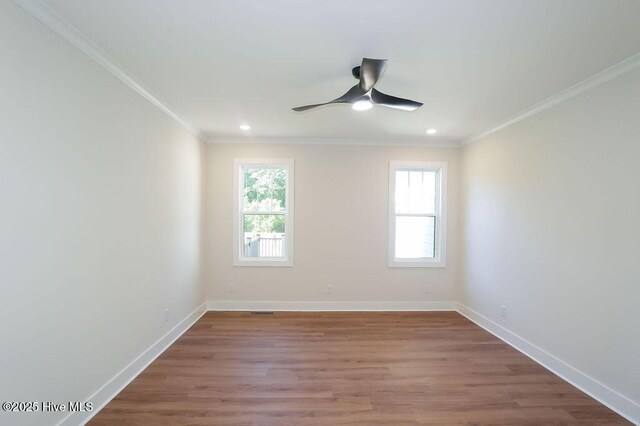 472 Yadkin Rd, Southern Pines, NC 28387 - spare room featuring ornamental molding, healthy amount of natural light, ceiling fan, baseboards, and recessed lighting