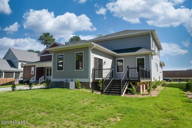 472 Yadkin Rd, Southern Pines, NC 28387 - view of front facade featuring a front lawn and central air condition unit