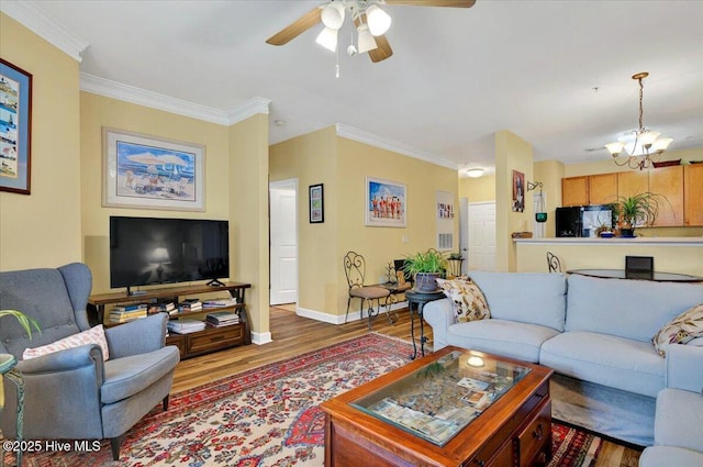 250 S Crow Creek Dr NW Unit 1, Calabash, NC 28467 - living room with a chandelier, a ceiling fan, wood finished floors, baseboards, and ornamental molding