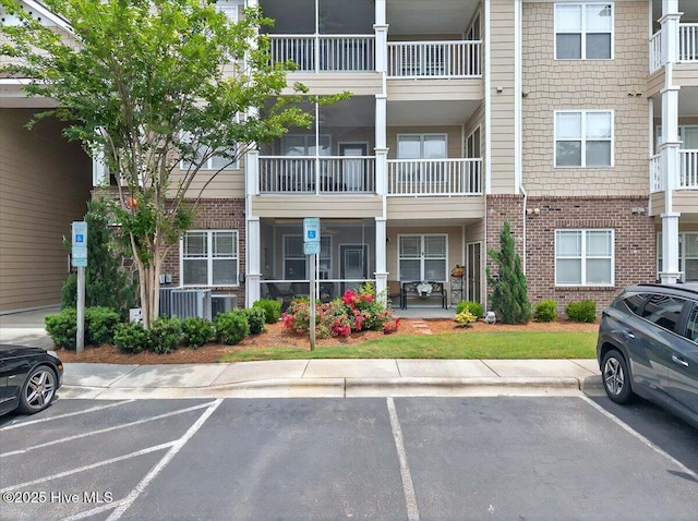 250 S Crow Creek Dr NW Unit 1, Calabash, NC 28467 - view of building exterior featuring uncovered parking and central AC
