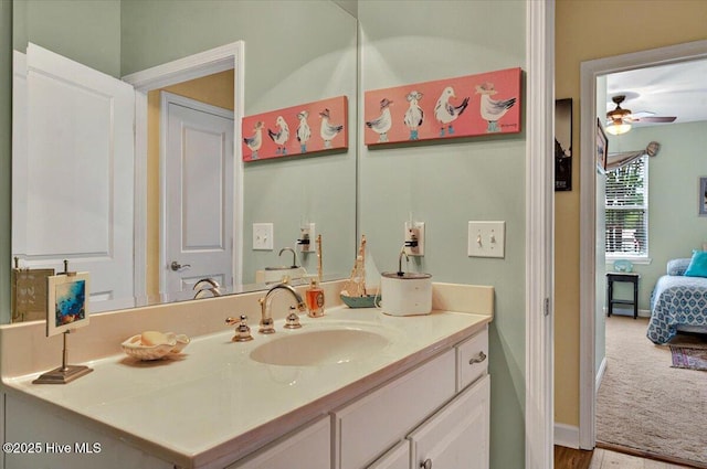 250 S Crow Creek Dr NW Unit 1, Calabash, NC 28467 - bathroom featuring ceiling fan, vanity, baseboards, and connected bathroom