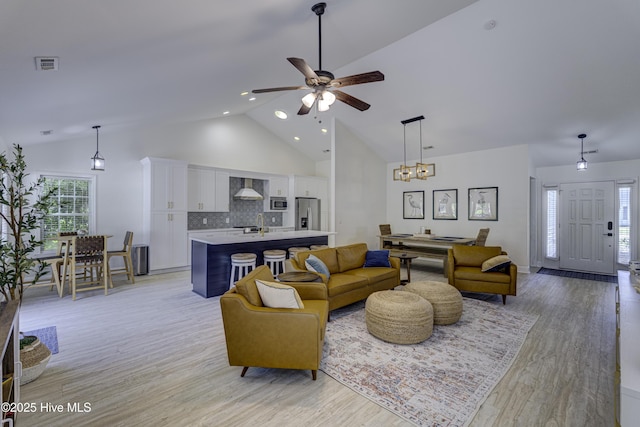 302 Gaskins Ln, Wilmington, NC 28411 - living area with ceiling fan, light wood-style flooring, high vaulted ceiling, plenty of natural light, and recessed lighting