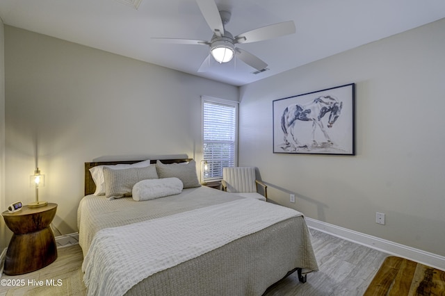 302 Gaskins Ln, Wilmington, NC 28411 - bedroom with wood finished floors, baseboards, and a ceiling fan