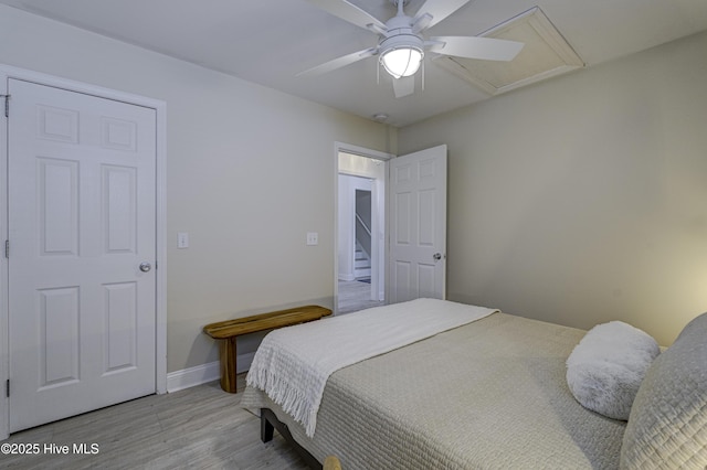 302 Gaskins Ln, Wilmington, NC 28411 - bedroom featuring light wood finished floors, baseboards, attic access, and a ceiling fan