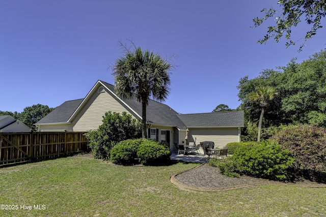 302 Gaskins Ln, Wilmington, NC 28411 - back of property with a patio area and roof with shingles