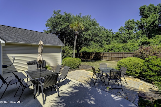 302 Gaskins Ln, Wilmington, NC 28411 - fenced backyard with outdoor dining space and a patio area