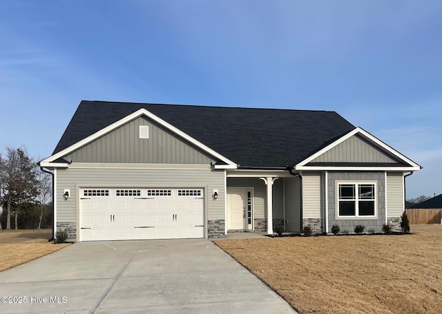 9427 Byron Ct Lot 208, Bailey, NC 27807 - craftsman house with concrete driveway, a garage, stone siding, a front yard, and board and batten siding