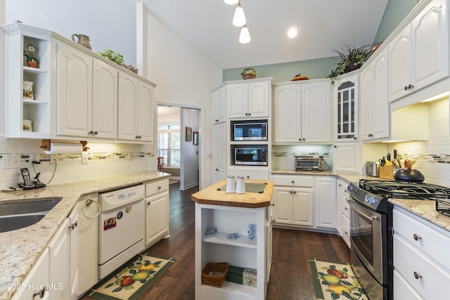 308 Crooked Gulley Cir, Sunset Beach, NC 28468 - kitchen with stainless steel appliances, open shelves, wooden counters, and decorative backsplash