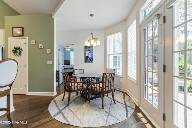 308 Crooked Gulley Cir, Sunset Beach, NC 28468 - dining room with plenty of natural light, dark wood-style flooring, and baseboards