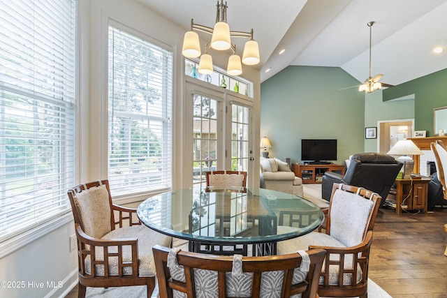 308 Crooked Gulley Cir, Sunset Beach, NC 28468 - dining room featuring healthy amount of natural light, hardwood / wood-style flooring, baseboards, high vaulted ceiling, and recessed lighting