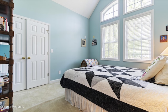 308 Crooked Gulley Cir, Sunset Beach, NC 28468 - carpeted bedroom with vaulted ceiling and a closet