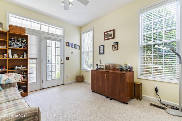 308 Crooked Gulley Cir, Sunset Beach, NC 28468 - entryway featuring carpet floors, ceiling fan, baseboards, and a textured ceiling