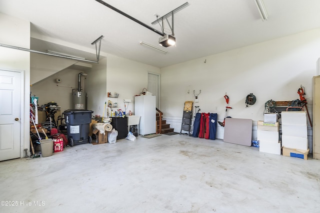 308 Crooked Gulley Cir, Sunset Beach, NC 28468 - garage featuring gas water heater, a garage door opener, and a sink
