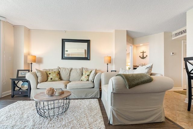 2000 New River Inlet Rd Unit 3113, North Topsail Beach, NC 28460 - living room with a textured ceiling, baseboards, and wood finished floors