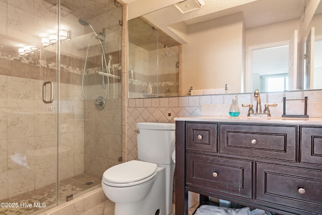 2000 New River Inlet Rd Unit 3113, North Topsail Beach, NC 28460 - full bathroom featuring tile walls, toilet, vanity, and a shower stall